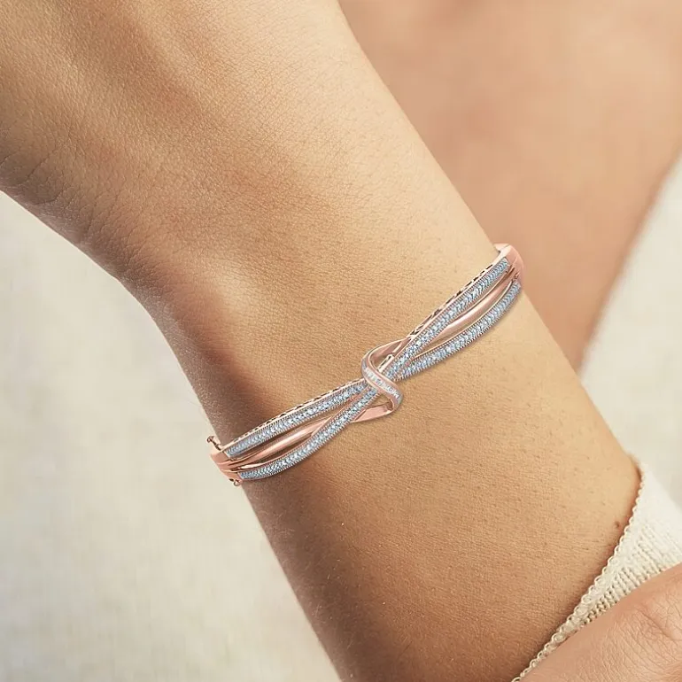 1/10 CT. T.W. Diamond Crossover Bangle Bracelet in Sterling Silver or 14K Gold Over Silver