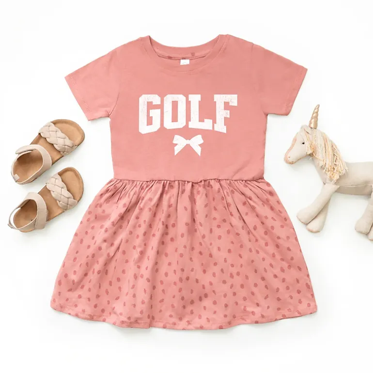 The Juniper Shop - Golf Arched Bow - Toddler Girl's Graphic Dress